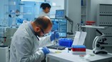 scientist-putting-blood-sample-from-test-tube